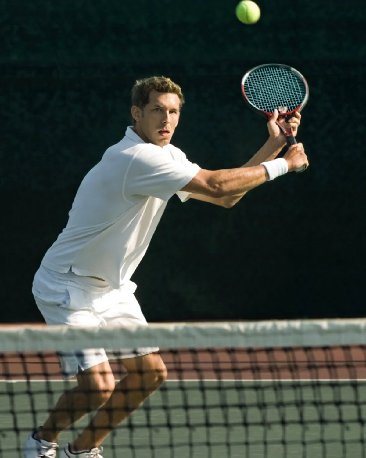 Tennis coaching on an outdoor court in Brentwood, Los Angeles