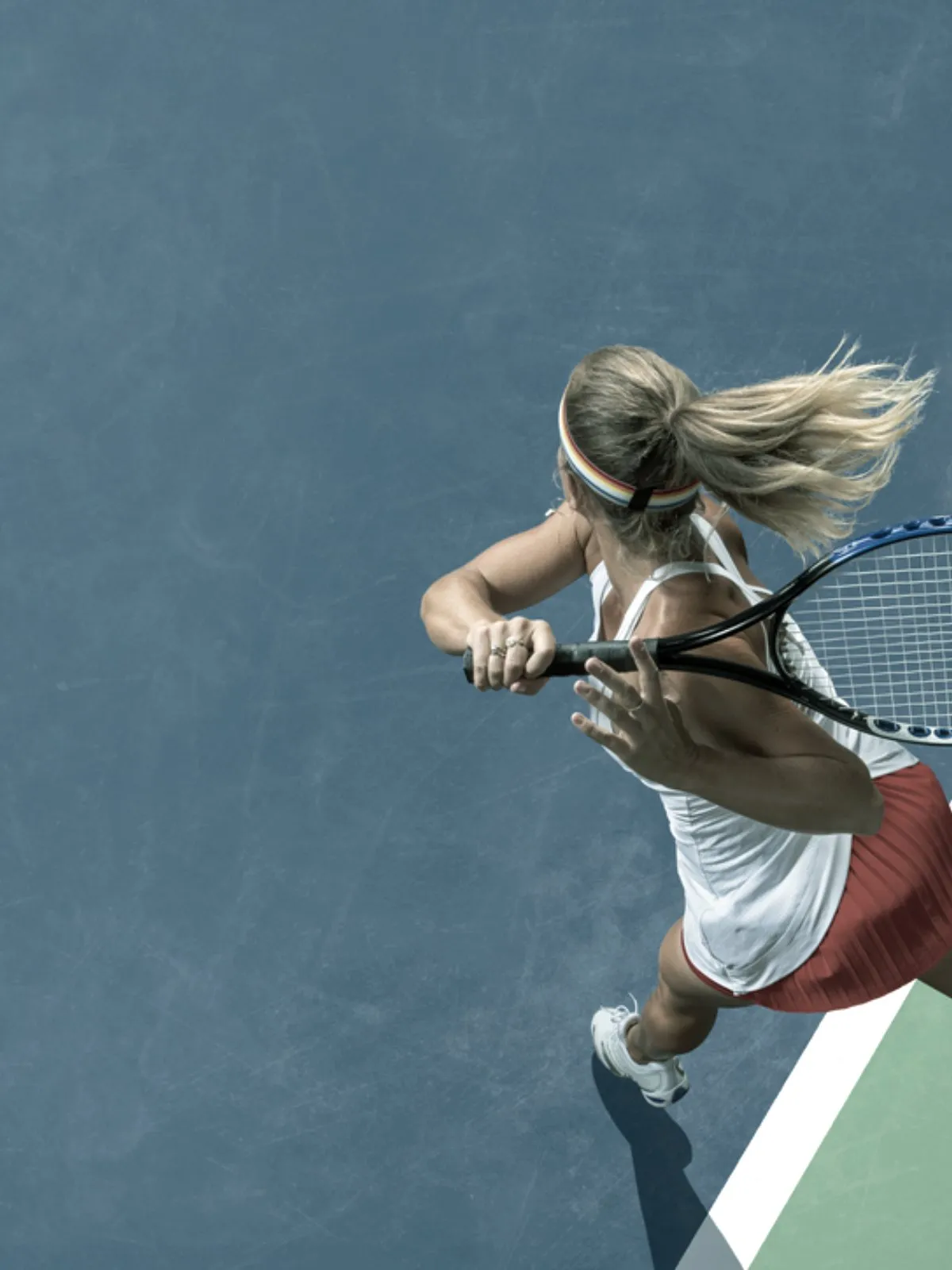 Player moving to a shot on a tennis court in Los Angeles