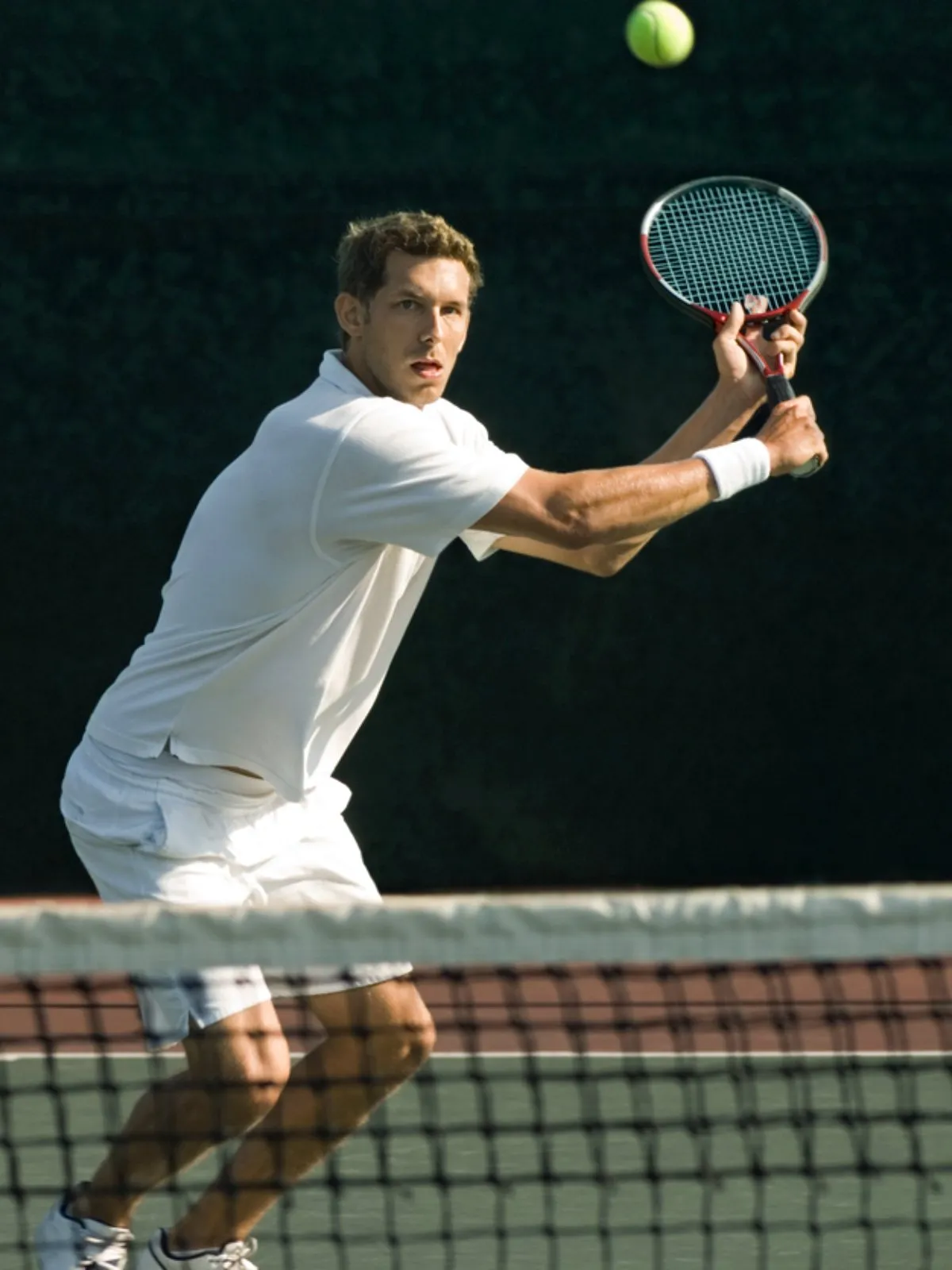 Tennis coaching on an outdoor court in Brentwood, Los Angeles
